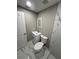 Bathroom featuring white marble-style tile flooring and a modern vanity at 4731 Foothill Dr, Holiday, FL 34690