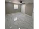 Bedroom with tile flooring, a ceiling fan, a window and a double door closet at 4731 Foothill Dr, Holiday, FL 34690