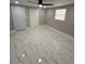 Bright bedroom with a ceiling fan, double door closet and stylish flooring at 4731 Foothill Dr, Holiday, FL 34690