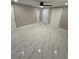Bedroom with white marble-style tile flooring, ceiling fan, and closet at 4731 Foothill Dr, Holiday, FL 34690