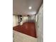 Spacious garage with red epoxy flooring at 4731 Foothill Dr, Holiday, FL 34690