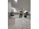 Modern kitchen boasts stainless steel appliances and attractive marble backsplash at 4731 Foothill Dr, Holiday, FL 34690