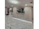 Comfortable living room featuring pass-through window and neutral paint at 4731 Foothill Dr, Holiday, FL 34690