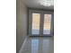Bright living space with access to the backyard through double glass doors at 4731 Foothill Dr, Holiday, FL 34690