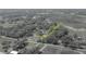 Majestic aerial panorama presents a rural community bordering expansive fields and a picturesque pond, highlighting the tranquil setting at 4814 Knights Loop, Plant City, FL 33565
