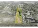 Extensive aerial view capturing diverse landscapes, including cultivated fields, woodlands, and clustered residential areas at 4814 Knights Loop, Plant City, FL 33565