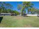 Expansive backyard with an array of trees, and buildings at 4814 Knights Loop, Plant City, FL 33565