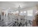 Dining area with a fireplace, views into the kitchen, and a modern light fixture at 4814 Knights Loop, Plant City, FL 33565