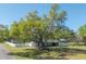 Charming single-story home with mature trees, spacious yard and white picket fence at 4814 Knights Loop, Plant City, FL 33565