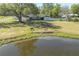 Charming single-story home featuring a pond, spacious lawn, and inviting covered porch at 4814 Knights Loop, Plant City, FL 33565