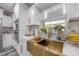 Modern kitchen with gold hardware, a golden farmhouse sink, and a window providing natural light at 4814 Knights Loop, Plant City, FL 33565