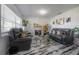 Comfortable living room with contemporary decor, marble floors and natural light at 4814 Knights Loop, Plant City, FL 33565