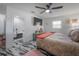 Spacious primary bedroom with an ensuite bathroom, ceiling fan and modern decor at 4814 Knights Loop, Plant City, FL 33565
