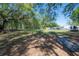 Spacious lot offering ample space and surrounded by mature shade trees at 4814 Knights Loop, Plant City, FL 33565