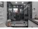 Luxurious shower features black marble-look tile, a glass enclosure, and a sleek black shower head fixture at 4814 Knights Loop, Plant City, FL 33565