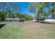 Expansive yard with an array of trees, buildings, and vegetation at 4814 Knights Loop, Plant City, FL 33565