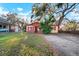 A single Gathering home with grass and a driveway at 5405 S Sellas St, Tampa, FL 33611