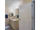 Bathroom with a neutral color palette, vanity, and a well-lit mirror, creating a serene space at 5839 Garden Lakes Dr, Bradenton, FL 34203