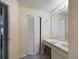 Bright bathroom featuring a vanity with ample counter space and a storage cabinet at 5839 Garden Lakes Dr, Bradenton, FL 34203