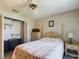 Comfortable bedroom featuring a bed, closet, and dresser at 5839 Garden Lakes Dr, Bradenton, FL 34203