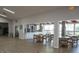 Open dining area with wood-look floors, brick accents and lots of natural light at 5839 Garden Lakes Dr, Bradenton, FL 34203