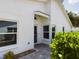 Inviting front entrance with tiled walkway, a stylish front door, and attractive landscaping at 5839 Garden Lakes Dr, Bradenton, FL 34203