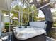 A hot tub offers a private and luxurious outdoor experience with lush green surroundings at 5839 Garden Lakes Dr, Bradenton, FL 34203