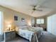 Cozy bedroom featuring a ceiling fan, natural light, and comfortable furnishings at 5839 Garden Lakes Dr, Bradenton, FL 34203