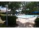Sparkling blue community pool surrounded by lush landscaping and comfortable lounge chairs for residents at 5839 Garden Lakes Dr, Bradenton, FL 34203