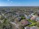 Lovely aerial view of a home nestled among lush trees in a serene neighborhood at 6107 Ibispark Dr, Lithia, FL 33547