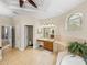 Large bathroom with dual sinks, tile floors, garden tub, and abundant natural light creating a serene retreat at 6107 Ibispark Dr, Lithia, FL 33547