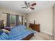 Relaxing bedroom with sliding door to patio, and a beautiful dresser enhances the home's appeal at 6107 Ibispark Dr, Lithia, FL 33547