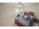 Cozy bedroom with neutral tones, a ceiling fan, and ample natural light at 6107 Ibispark Dr, Lithia, FL 33547