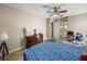 Bedroom with warm neutral tones, ceiling fan, and carpeted floor offers a cozy and inviting atmosphere at 6107 Ibispark Dr, Lithia, FL 33547