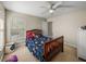 Comfortable bedroom with a ceiling fan and a bright window at 6107 Ibispark Dr, Lithia, FL 33547