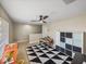 Spacious bonus room with ceiling fan, storage, and play area at 6107 Ibispark Dr, Lithia, FL 33547