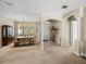 Welcoming dining area with stylish lighting, neutral tones, and a seamless transition to the entryway at 6107 Ibispark Dr, Lithia, FL 33547