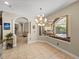 View of the dining room showcasing a large window overlooking the pool area at 6107 Ibispark Dr, Lithia, FL 33547