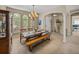 Bright dining area featuring a wooden dining table set and large windows that let in natural light at 6107 Ibispark Dr, Lithia, FL 33547