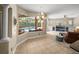 Dining area view towards the pool and living room, highlighting the open floor plan at 6107 Ibispark Dr, Lithia, FL 33547