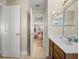 Hallway leading to a bedroom with a glimpse of a vanity area at 6107 Ibispark Dr, Lithia, FL 33547