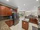 Spacious kitchen features granite counters, stainless appliances, and island with pendant lighting at 6107 Ibispark Dr, Lithia, FL 33547
