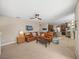 Spacious living room flowing into the kitchen, complete with comfortable seating and modern décor at 6107 Ibispark Dr, Lithia, FL 33547
