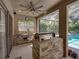 Outdoor kitchen offers a grill, sink and counter space at 6107 Ibispark Dr, Lithia, FL 33547