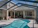 Enjoy the beautiful, screened-in pool with a patio area perfect for relaxation and entertaining, featuring ample seating at 6107 Ibispark Dr, Lithia, FL 33547
