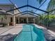 Inviting screened-in pool offers a refreshing escape with ample space for lounging and entertaining outdoors at 6107 Ibispark Dr, Lithia, FL 33547