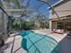 Beautiful screened-in pool with spa, ample deck space, and sunny views perfect for outdoor enjoyment at 6107 Ibispark Dr, Lithia, FL 33547