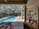 View of lanai seating area and pool at 6107 Ibispark Dr, Lithia, FL 33547