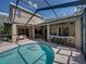 Relax by the refreshing pool with an attached outdoor bar and ample seating perfect for entertaining guests at 6107 Ibispark Dr, Lithia, FL 33547
