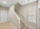 Bright staircase featuring neutral colored walls and tile flooring at 6107 Ibispark Dr, Lithia, FL 33547